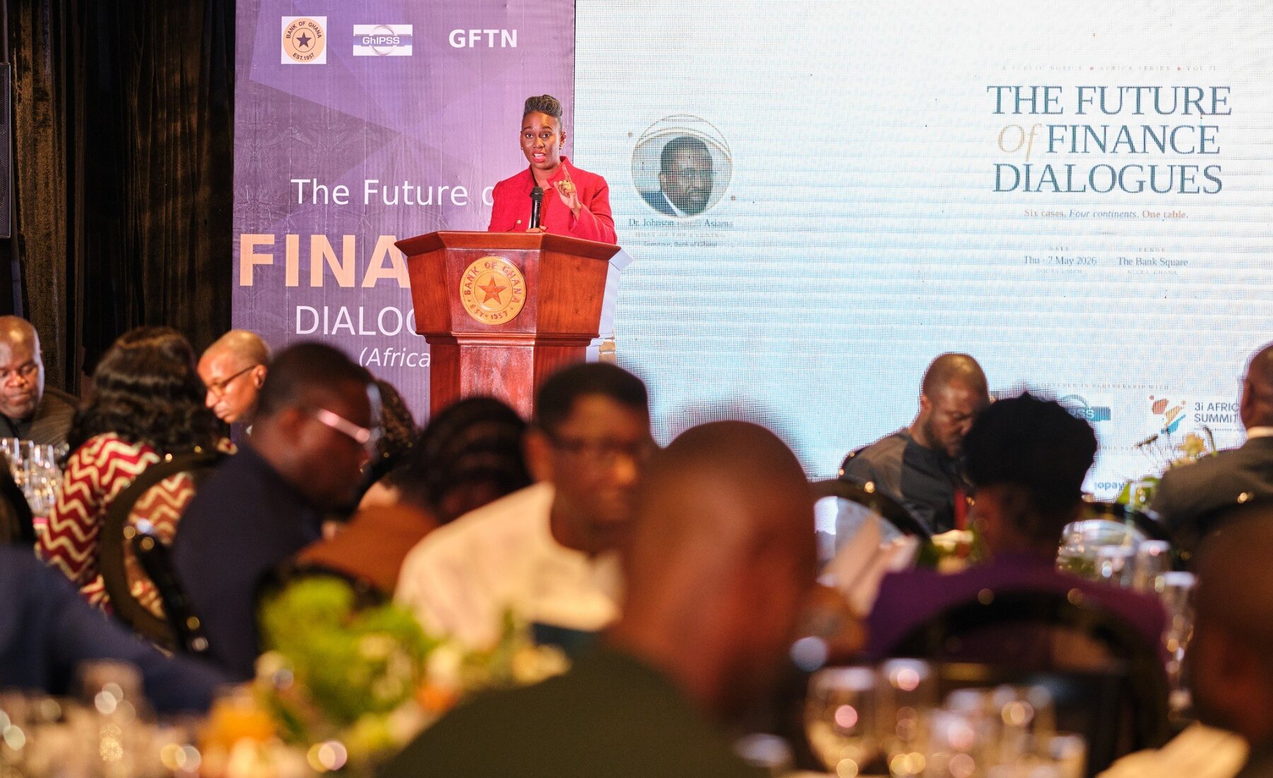 Ethel Cofie speaking at podium