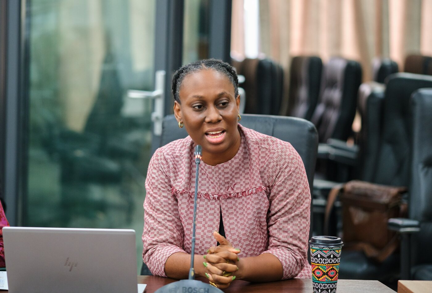 Ethel Cofie speaking in an institutional meeting