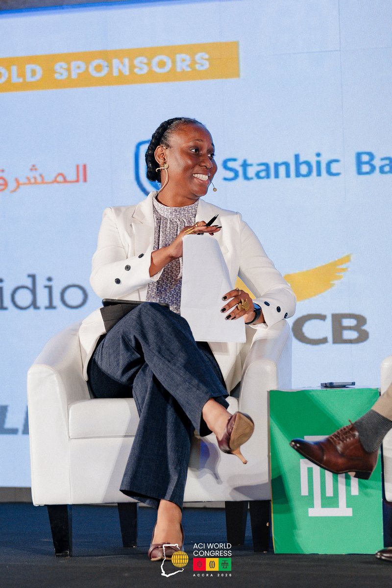 Ethel Cofie moderating on stage